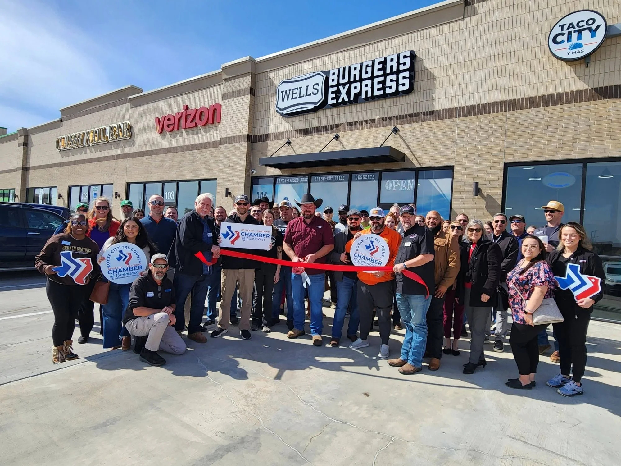 Ribbon cutting at Wells Burgers Express with the Royse City Tri-County Chamber of Commerce